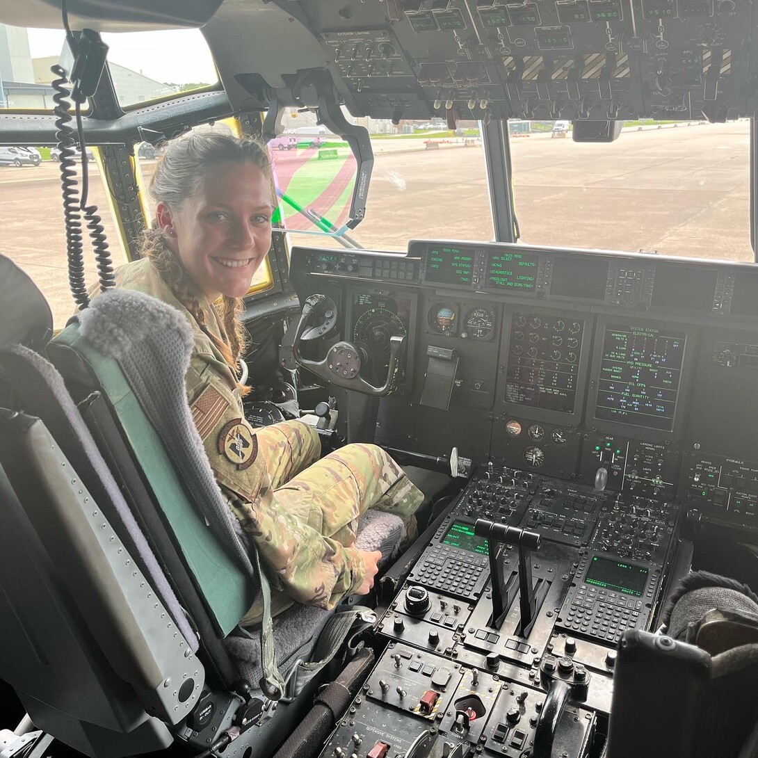Air Force ROTC Cadet Maggie Gochenour sits in cockpit of C-130 