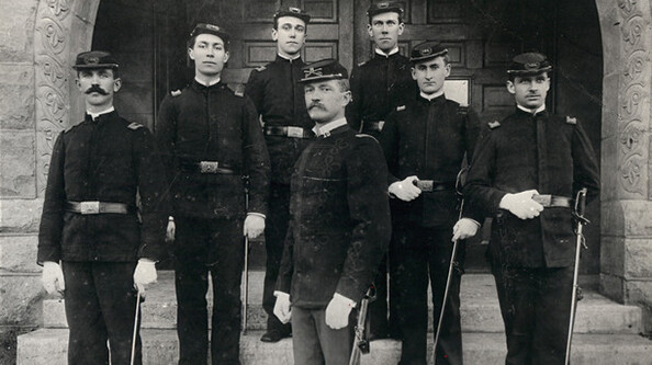 John J. Pershing poses with Nebraska U cadets during his tenure on campus. Pershing will be honored as part of new World War I service plaques being installed in Memorial Stadium.