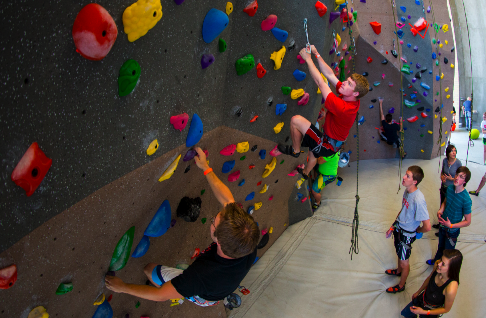 Students try out the new Outdoor Adventures Center climbing wall during the May 1 open house. The facility opens to the public today (May 5).