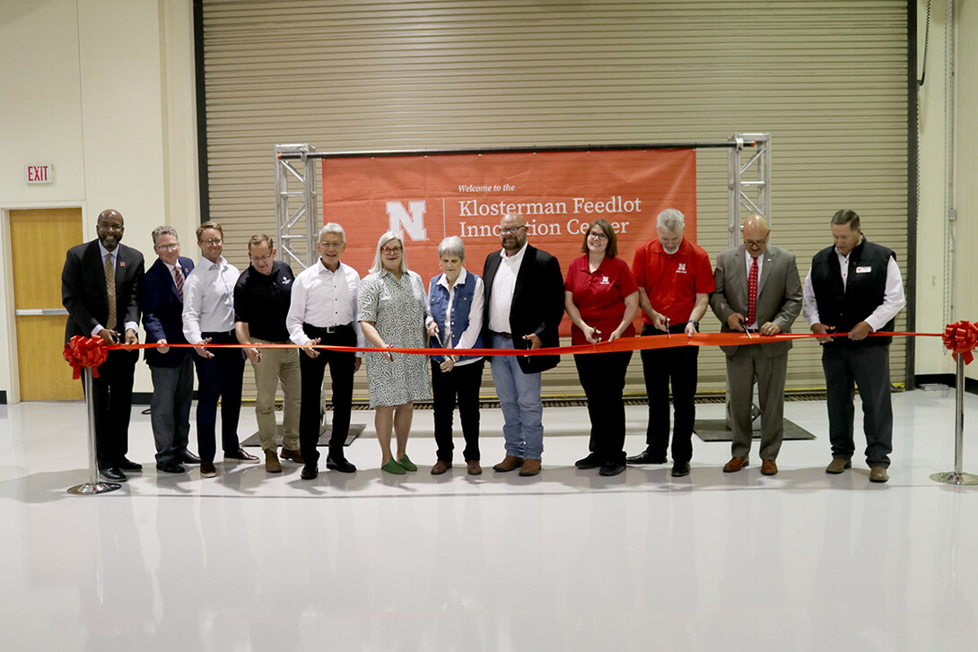 Those cutting the ribbon were (from left) University of Nebraska–Lincoln Chancellor Rodney Bennett; Derek McLean, Agricultural Research Division dean and director; Jason Weller, JBS Foods USA chief global sustainability officer; Mark Jensen, CEO of Farm Credit Services of America; Henry Davis, president/CEO of Greater Omaha Packing Co.; Meg Klosterman Kester; Beth Klosterman; Jack Klosterman; Deb VanOverbeke, Animal Science Department head; Galen Erickson, Nebraska Cattle Industry Professor of