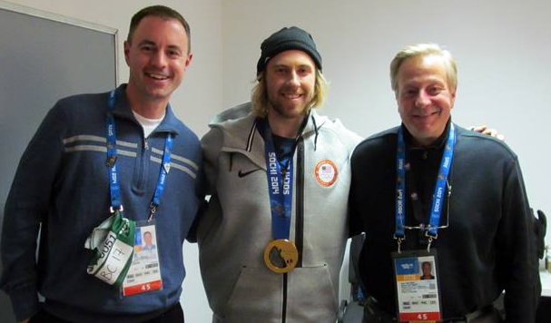 Kevin Kugler (from left) poses with snowboard slopestyle gold medal winner Sage Kotsenberg and fellow Westwood One anchor John Tautges following an interview at the Olympic games in Sochi, Russia.