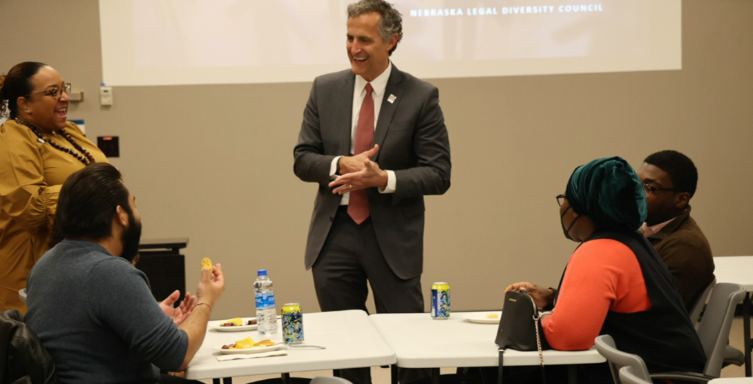 Richard Moberly, dean of law, talks with students during a college event.