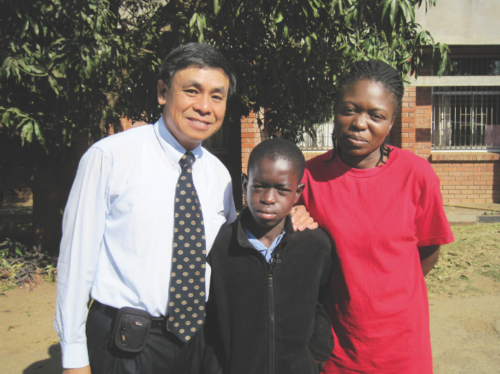 UNL's Charles Wood and two of patients in Zambia,  Jailos Zulu (left) and Tina Kaaya. The mother/son duo have been patients at Wood's Zambia clinic since Jailos was born.