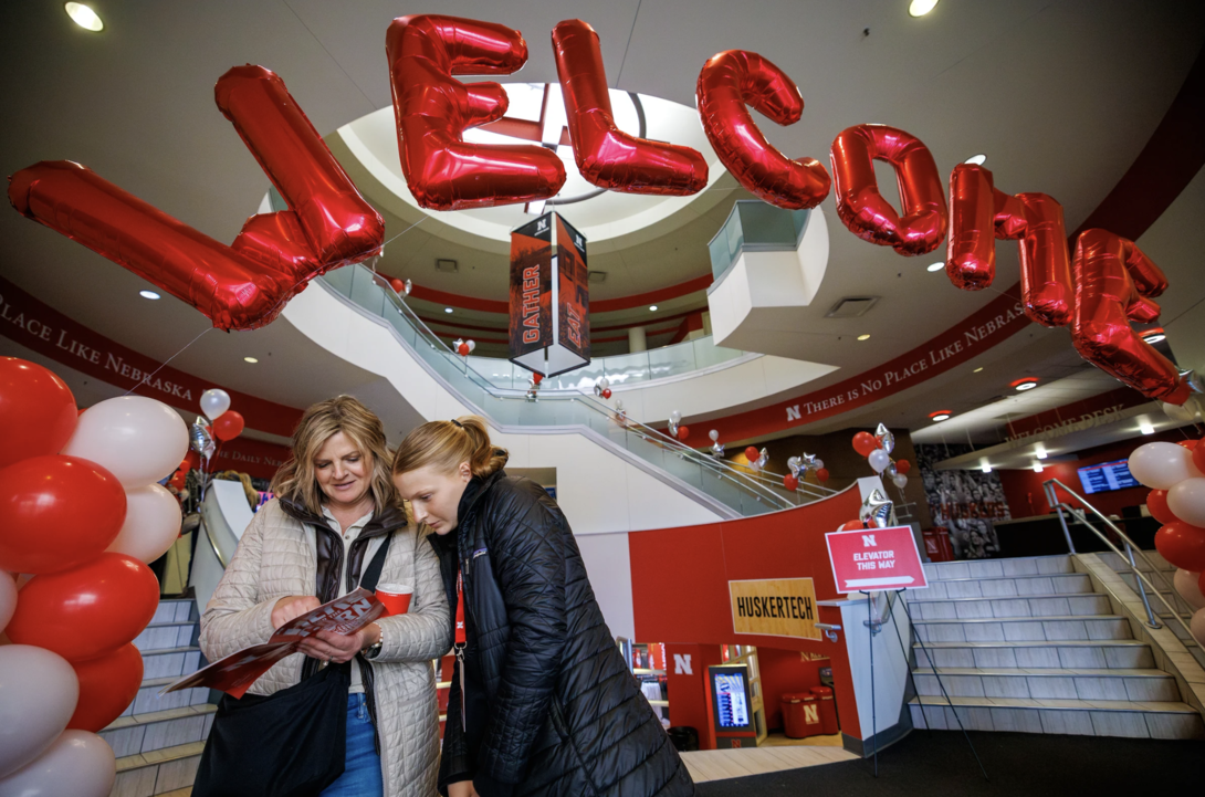 Misty and Kaegan Fredrickson of Britton, South Dakota, look over the Admitted Student Day program in the Nebraska Union on March 23.