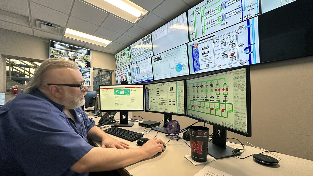 Kenneth Smith watches monitors that show output rates of boilers and chillers at the university's City Campus utility plant. Smith has worked in the plant for 25 years, making sure heating and cooling in campus buildings stays at comfortable levels.