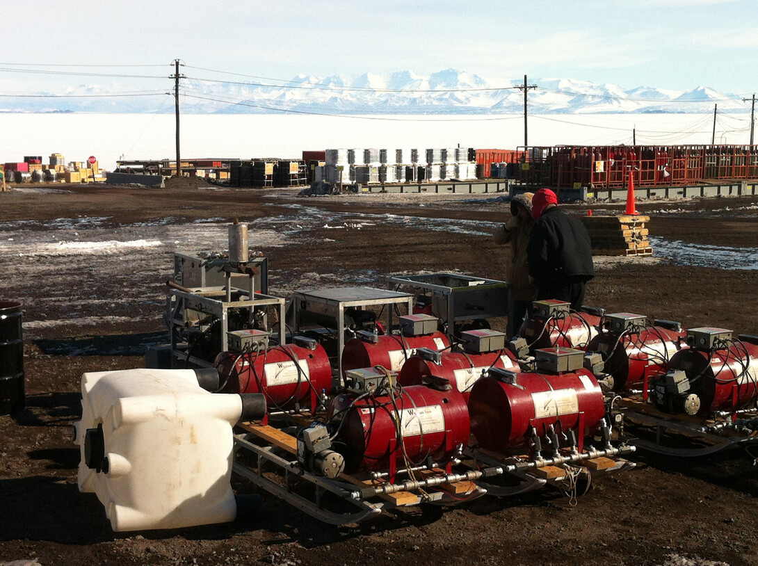 ANDRILL's roving hot water drill is on the ground in Antarctica at McMurdo Station on Ross Island. McMurdo Sound and the Transarctic Mountains on the Antarctic mainland are in the background.