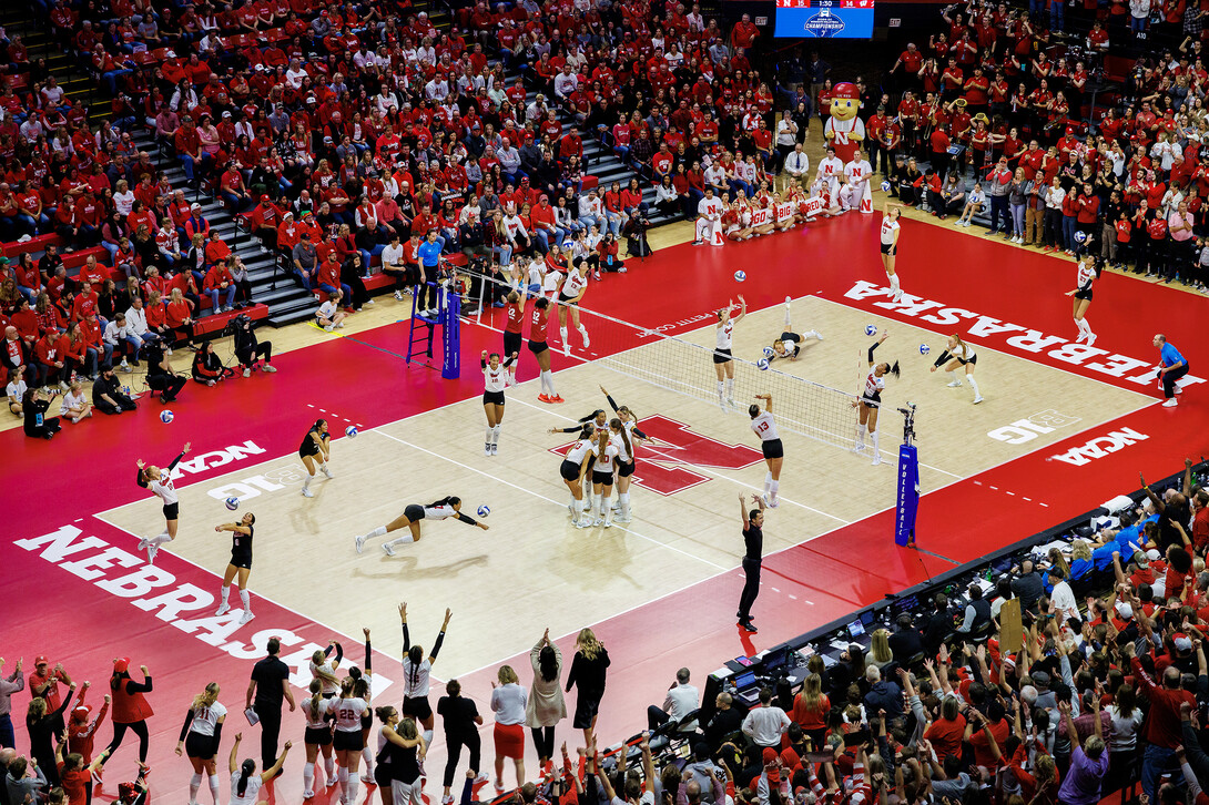 A composite photo showing Nebraska volleyball compete against Wisconsin during the NCAA Volleyball Tournament Regional Final at the Bob Devaney Sports Center.