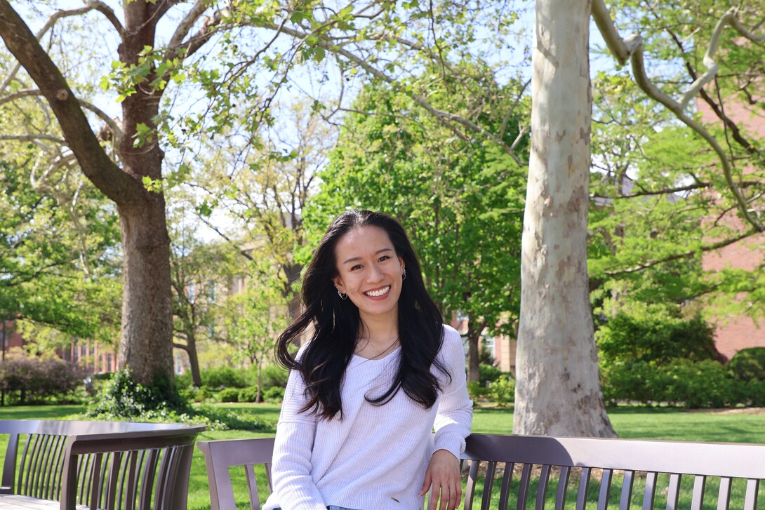 Courtesy photo // Xin May Kok— an integrated media communications graduate student from Banting, Selangor, Malaysia — poses for a photo on benches near Canfield.