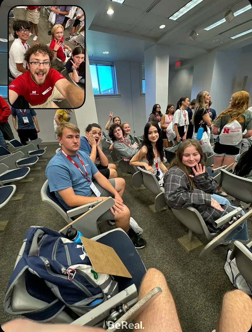 Students waving during a BeReal moment.