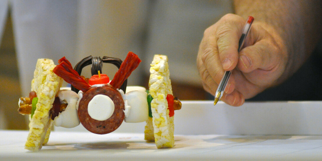 A judge examines an entry from the 2011 Incredible, Edible Car Competition. 