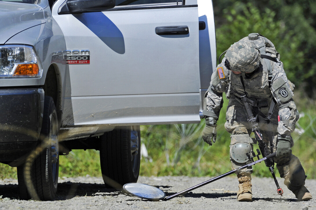 A vehicle is examined at a military checkpoint in this photo from the Department of Defense. The National Strategic Research Institute has earned a $1 million contract to continue its research on improving military checkpoints.