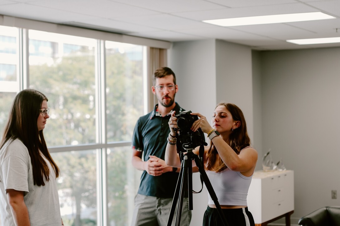 Students working with a professional in residence