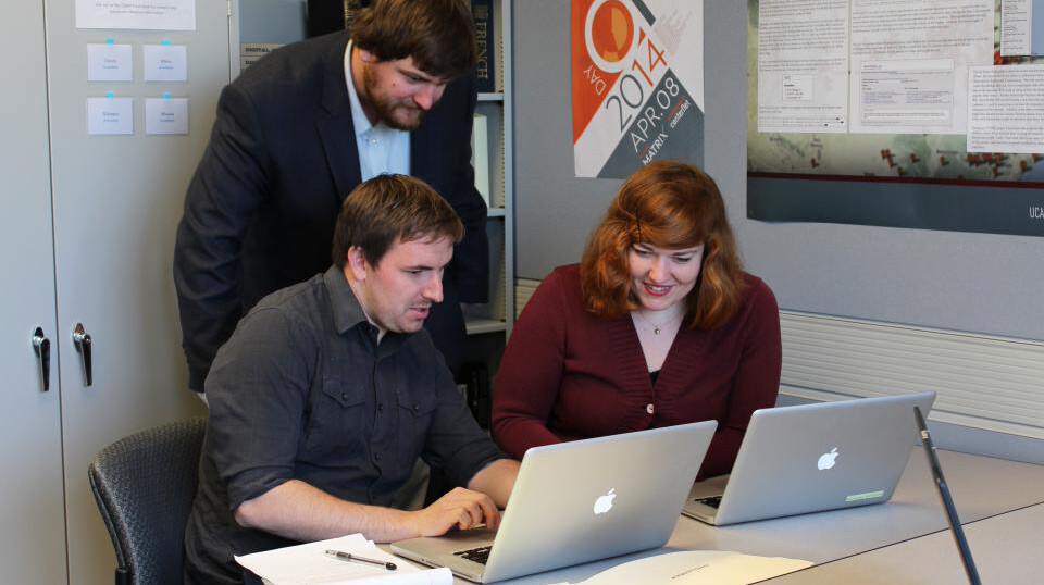 Students (from left) Kevin McMullen, Brian Sarnacki and Rebecca Ankenbrand work in the Center for Digital Research in the Humanities incubator in fall 2014. The CDRH is celebrating its 10th anniversary in April.