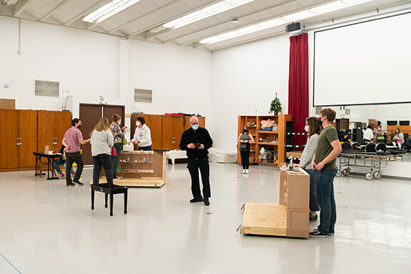 Nebraska's William Shomos (center) plays Mr. Maraczek during a rehearsal for “She Loves Me.” 