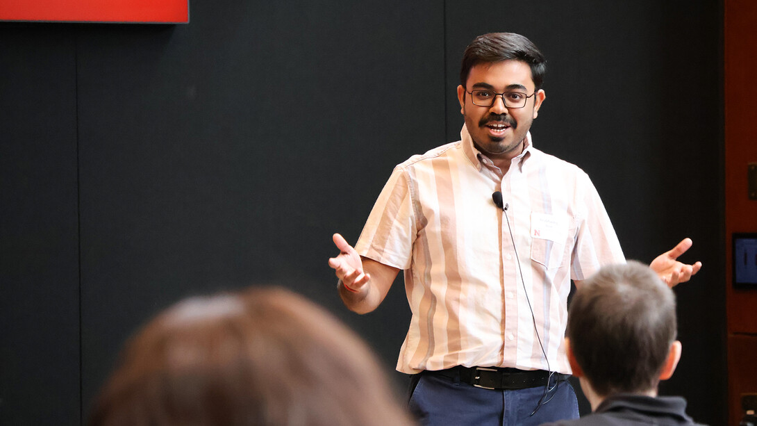 Prabhashis Bose, a graduate student in food science and technology, speaks on stage during the Student Research Days Slam at the University of Nebraska–Lincoln on April 9.