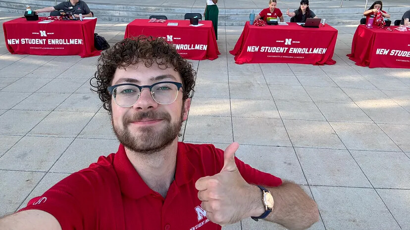 student leader giving a thumbs up.