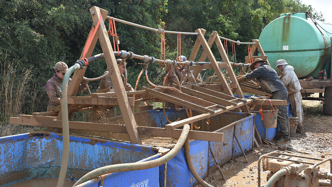 The team used a unique process (wet-screening) to process the very sticky clay sediments to recover possible evidence related to this crash site.